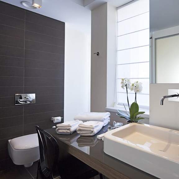 bathroom with sink and towels