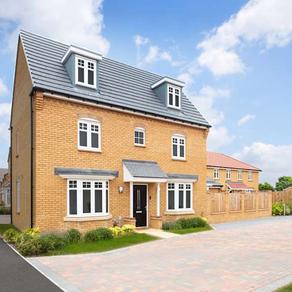 a brick house with a black door and windows.