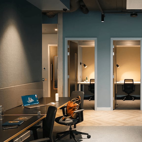 a modern office space with desks, chairs, and computers. at cherrywood apartments, d18 vy3v