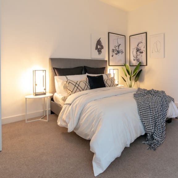 Thumbnail 1 of 6 a bedroom with a bed and a closet at The Keel Apartments, Liverpool, L3 4GE