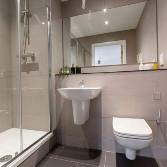 Thumbnail 4 of 5 a bathroom with a toilet sink and shower at Vox Apartments, Manchester, M15 4YD