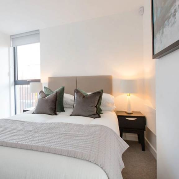 Thumbnail 1 of 8 Bedroom with cozy bed at Vox Apartments, Manchester