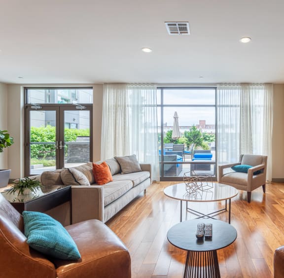 a living room with couches and a coffee table and a fireplace