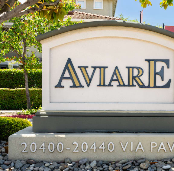 a sign that says in front of a house
