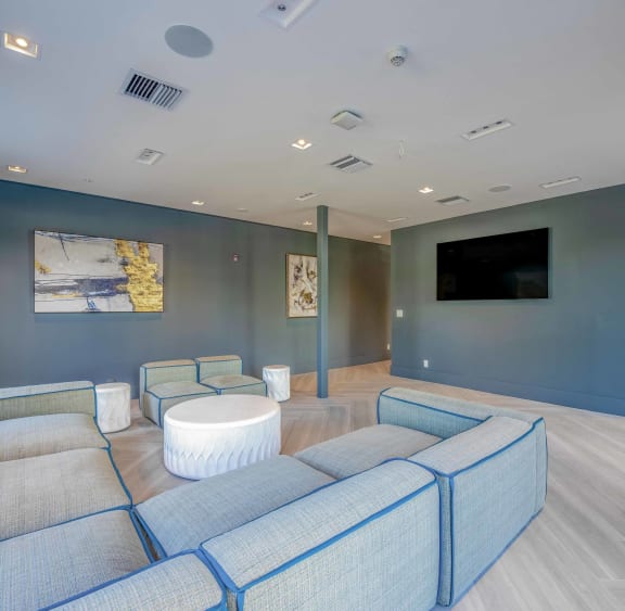 Countyline Apartments in Miami FL photo of clubhouse with plush seating and a tv