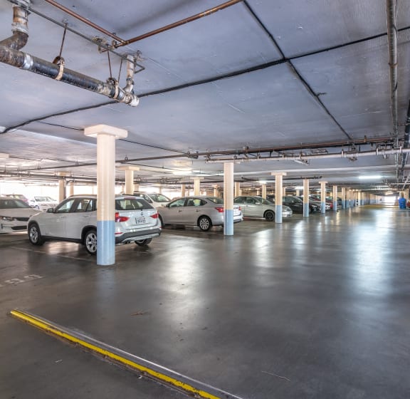 a parking garage with cars parked in it