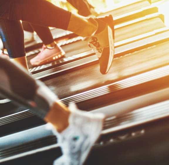 people running on a treadmill in the gym