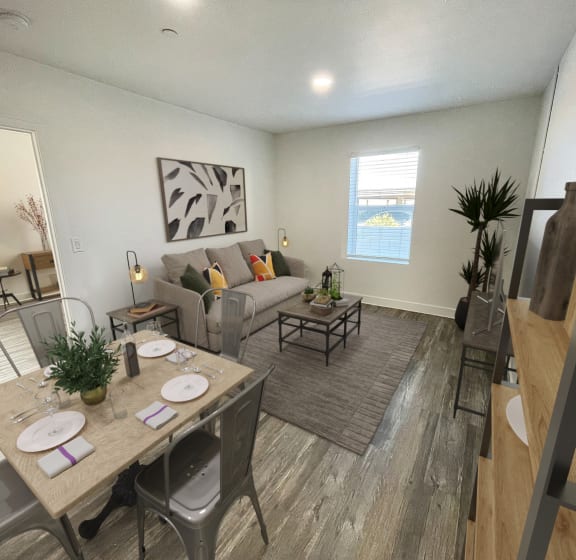a living room and dining room with a couch and a table