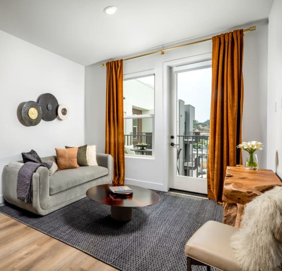 a living room with a couch chair and coffee table  at VORA LUX, San Diego, CA