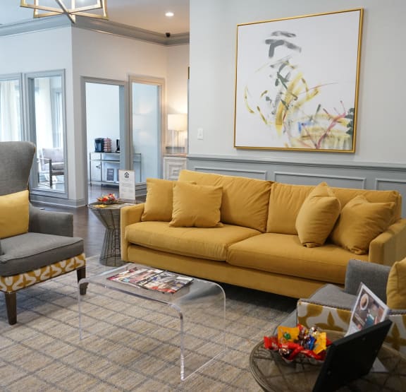 Living Room with a Yellow Couch at Seven Pines Apartments in Alpharetta, GA 30022