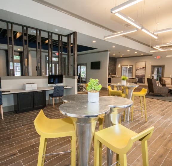 a kitchen with a table and chairs and a tv