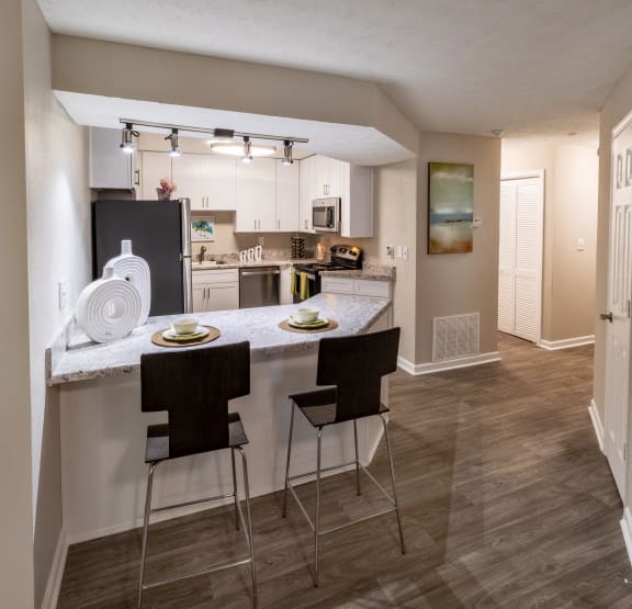 Open Kitchen with Dining Area at Seven Pines Apartments in Alpharetta, GA 30022
