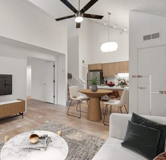 a living room with a couch and a table and a tv at AVIA Lofts on Parkway Apartments, Vancouver, 98662