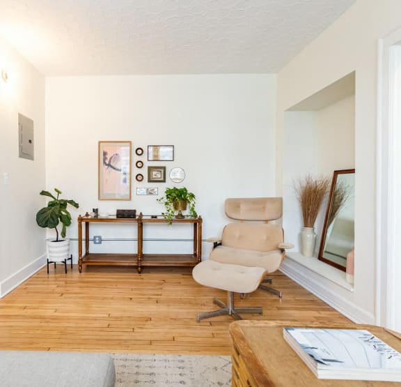a bedroom with a bed and bookshelves     and a chair