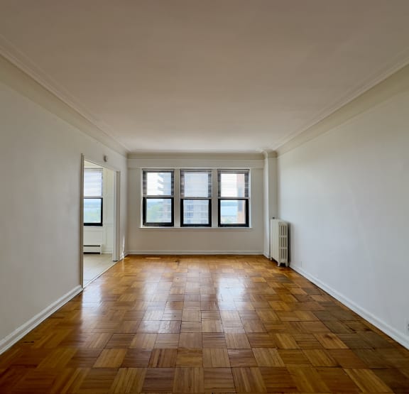 a bedroom with a bed and bookshelves     and a chair