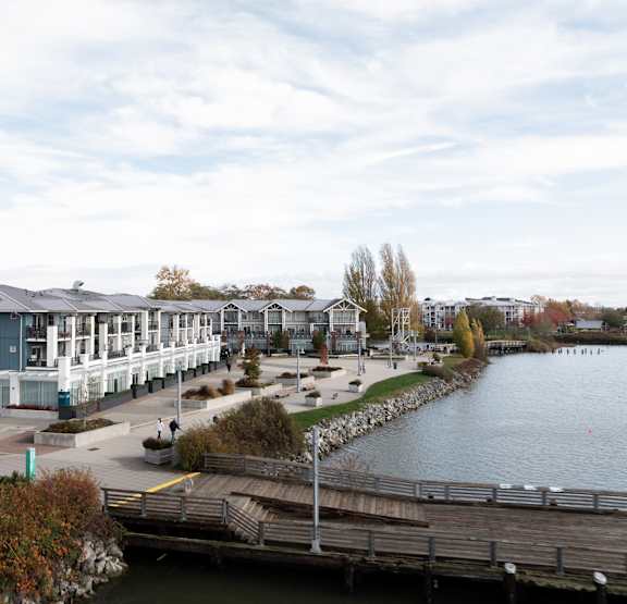 A dock with a building in the background.