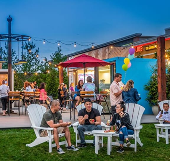 a group of people sitting and standing around a patio at Vyne One Loudoun, Ashburn, Virginia