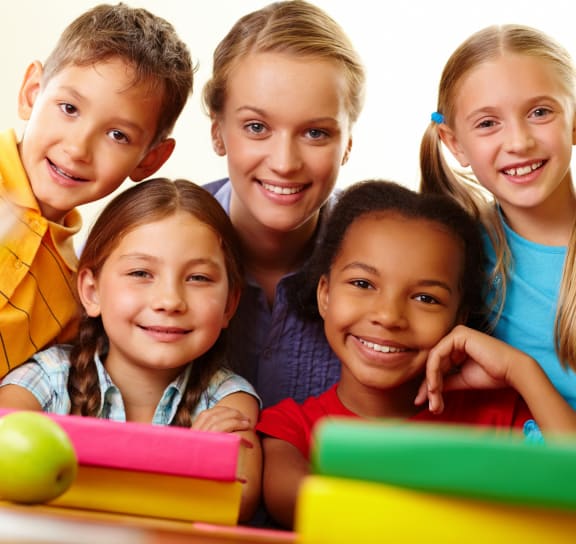 a group of children posing for a picture with toys