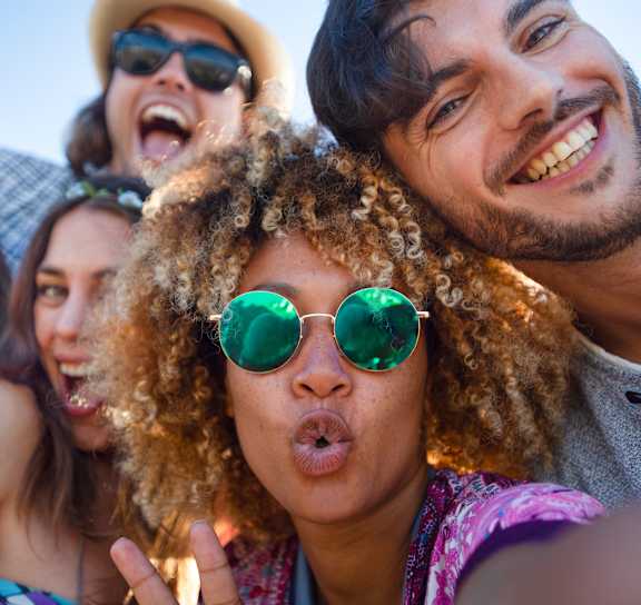 a group of people posing for a picture wearing sunglasses at Orchard Lakes Apartments in Toledo, OH