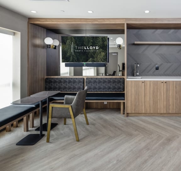 a dining room with a table and chairs and a kitchen