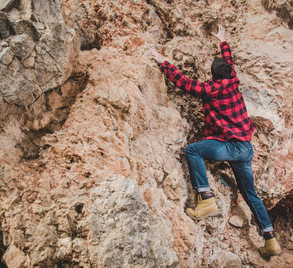 Man Climbing mountain at The Vue At Desert Color, St. George, UT, 84790