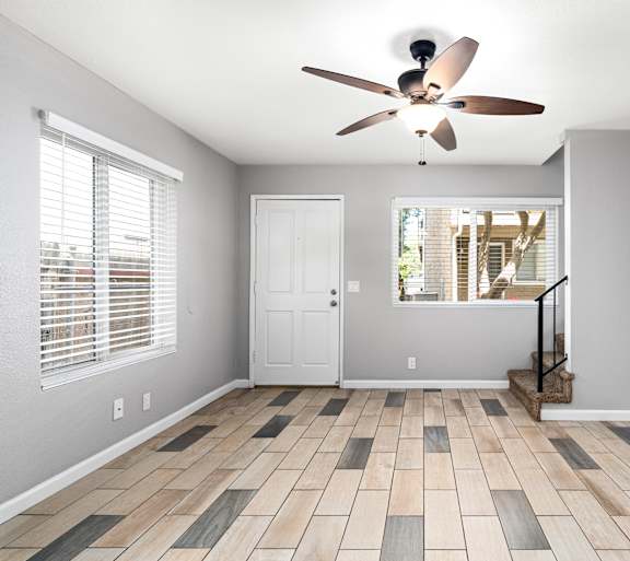 Empty room with ceiling fan at OSM Properties Homes & Apartments, Chico, California