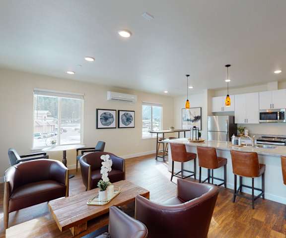 a living room with a kitchen and a dining room