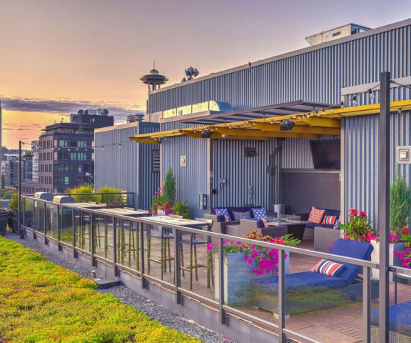 a rooftop patio with a view of the city