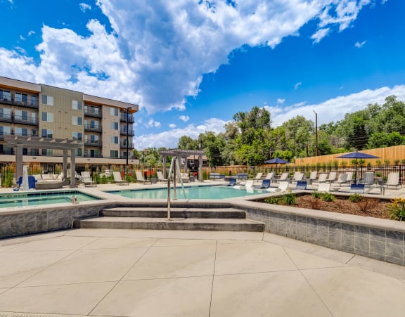 a swimming pool with a building in the background