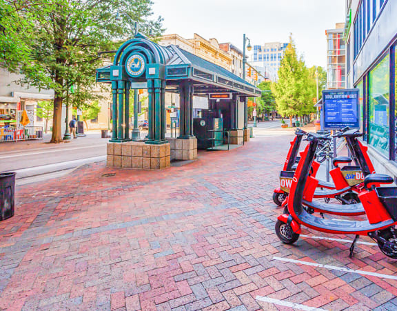a red scooter parked in front of a store