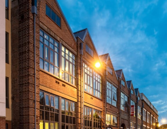 A building with a sunset in the background.