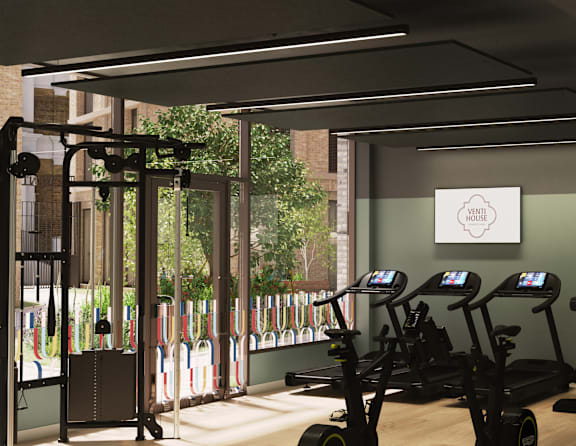 A gym with treadmills and exercise bikes.