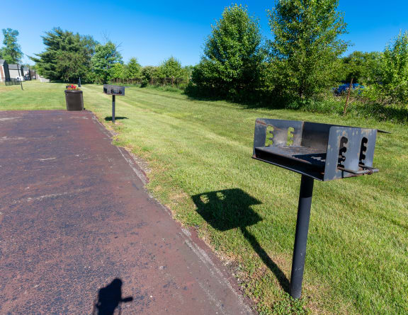 a mailbox on the side of a path in a park