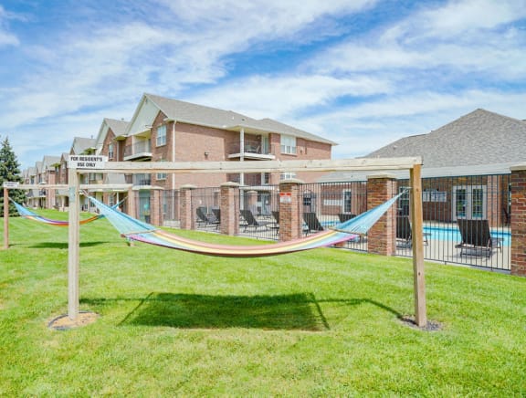 two rainbow striped hammocks outside the clubhouse at Williamsburg Park apartments in Lincoln