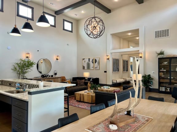 a living room with a kitchen and a dining table