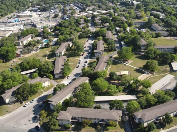an aerial view of a neighborhood of houses and trees at Sunset Ridge, Texas, 78209