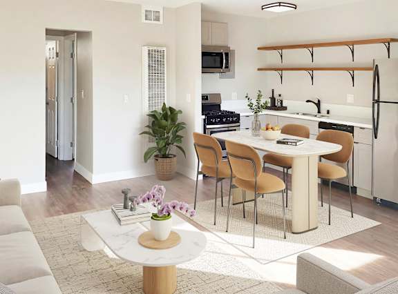 A modern living room with a white sofa and a coffee table.