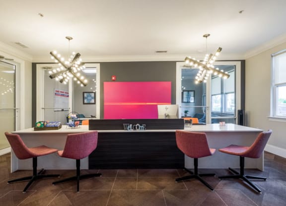 a kitchen and dining area with chairs and a counter at Linden on the GreeneWay, Florida, 32824