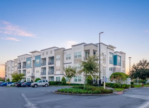 a building with cars parked in front of it at Linden on the GreeneWay, Orlando, 32824