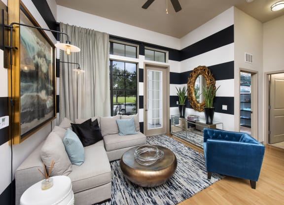 a living room with a gray couch at Azul Baldwin Park, Florida, 32814