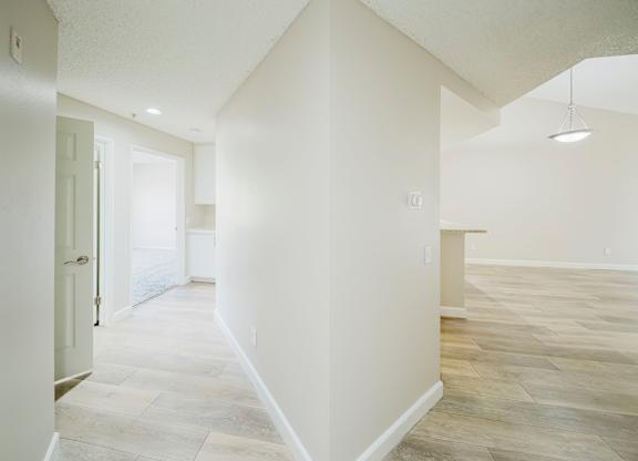 A spacious room with light-colored walls and a wooden floor. at Legends at Rancho Belago, California
