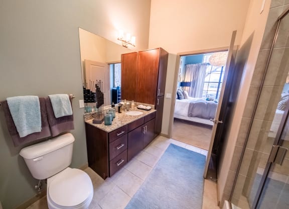 a bathroom with a toilet and a sink and a shower at Azul Baldwin Park, Orlando
