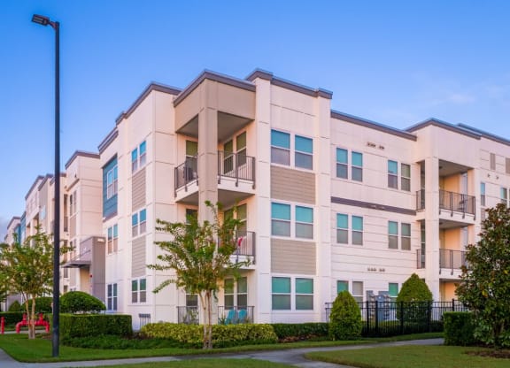 a building with a sidewalk in front of it at Linden on the GreeneWay, Florida