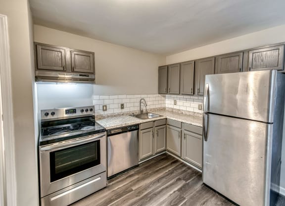 a kitchen with stainless steel appliances and a stainless steel refrigerator at Ashford Place Apartments, Kannapolis North Carolina