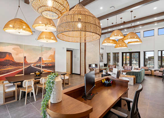 A modern interior with a large wooden table and chairs.