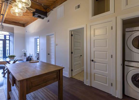 A laundry room with a washer and dryer in it at The Dean at Creekview Apartments, Newark, DE