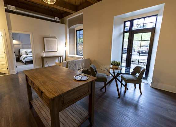 A dining room with a wooden table and chairs at The Dean at Creekview Apartments, Newark