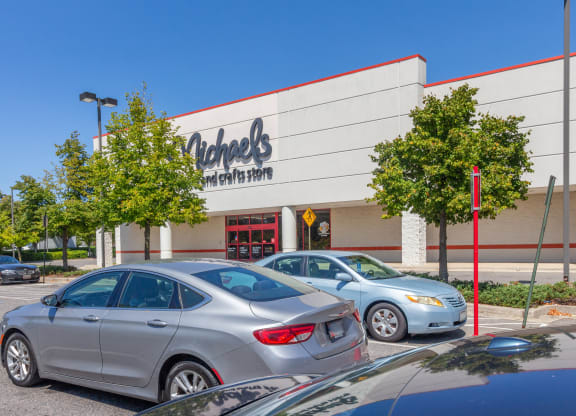 a car dealership with cars parked in front of it at Fairmont at South Lake, Bowie, Maryland