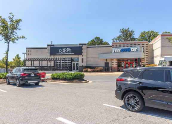 a parking lot with cars parked in front of a restaurant at Fairmont at South Lake, Bowie, MD, 20716