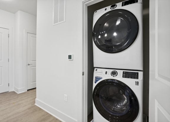 a washer and dryer in a laundry room at Fairmont at South Lake, Bowie Maryland